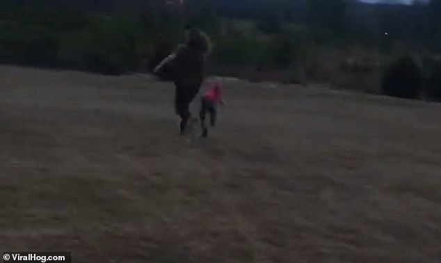 The little girl is sent sprawling to the ground and bursts into tears after her aunt pushes her over
