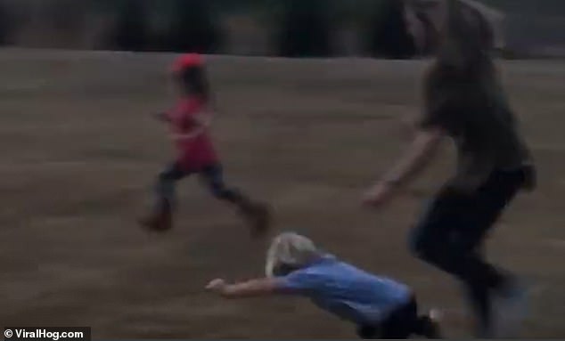 Their aunt sends her young nephew flying as she pushes his head to take him out of the race