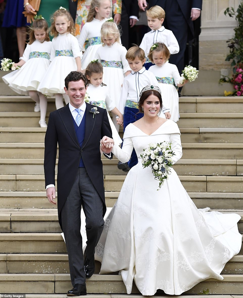 Princess Eugenie of York and her husband Jack Brooksbank leave after their wedding at St George