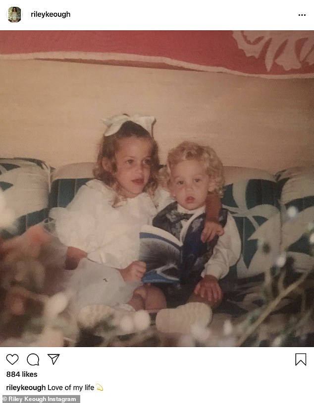 Memories: Riley Keough, 31, posted a sweet childhood photo to Instagram on Thursday of herself reading a book to her late brother Ben, who died by Suicide on July 13 at age 27