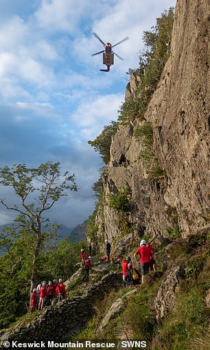 A mountain recovery team carried out a dramatic rescue after a 60-year-old climber plunged 40ft down a crag