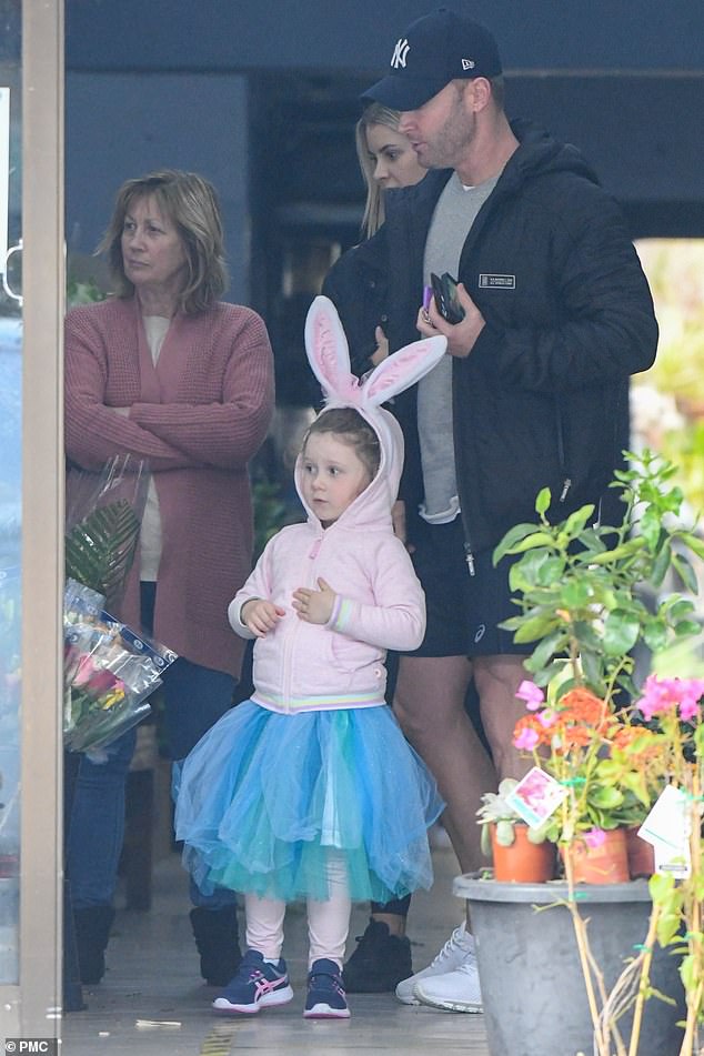 Cute: Kelsey Lee wore large bunny ears over a pink jumper, and a blue tulle tutu skirt