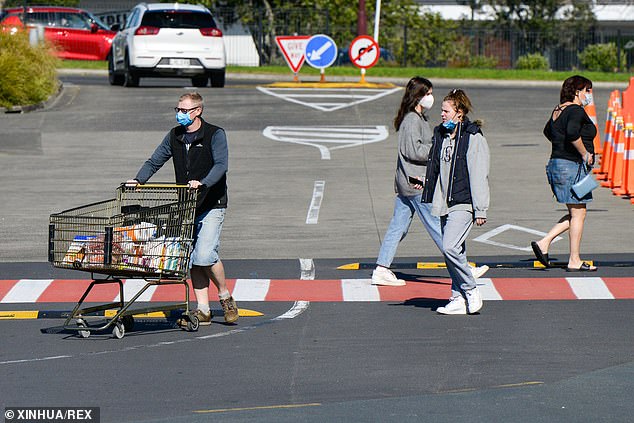 People visit a supermarket in Auckland, New Zealand during the lockdown on August 15