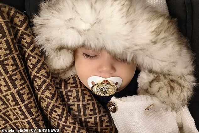 The stay-at-home mom said she loves posing Anita (pictured as a baby with a gold Versace pacifier) in fashion snaps for her Instagram and has already collaborated with several brands