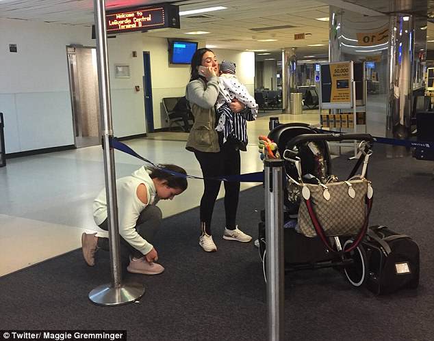 The family (pictured at the airport) said Kokito barked for two hours of their three-hour flight to New York