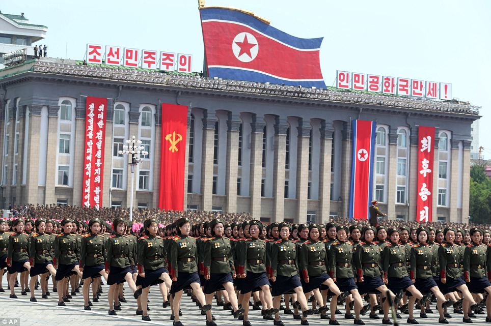Unarmed cadres of female soldiers goose-step their way through Kim Il Sung square in the parade, which was also attended by the vice president of China, North Korea