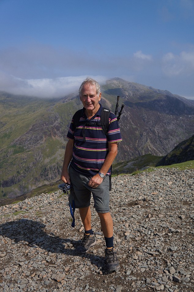 Super fit George, pictured on a hike, will climb Scafell Pike this summer as well as completing running, cycling and skiing challenges. 