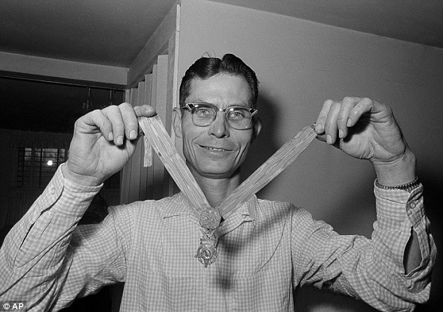 Doss (pictured with his Medal of Honor in 1966) faced harassment from other soldiers while training in the states, due to his devotion to prayer, refusal to handle weapons and eat meat and his observation of the Sabbath.