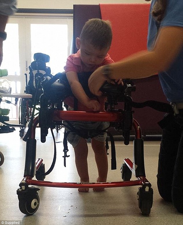 Bobby Webber, now aged two, needs a walking frame after a bashing he suffered as a seven-month old baby left him with a quadriplegic needing constant care 