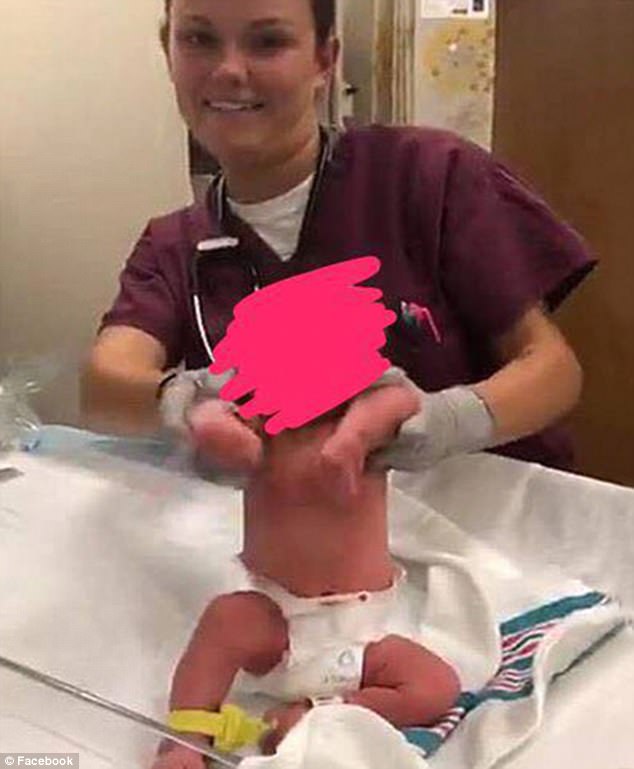 Two corpsmen have been removed from duty at Naval Hospital Jacksonville, in Florida, after uploading images of themselves messing around with newborns to Snapchat. This image was taken from a video that shows the staffer making the baby 